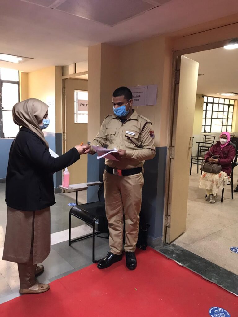 Vaccination Officer verifying the beneficiary